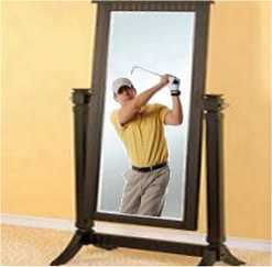 practicing a golf swing in the mirror