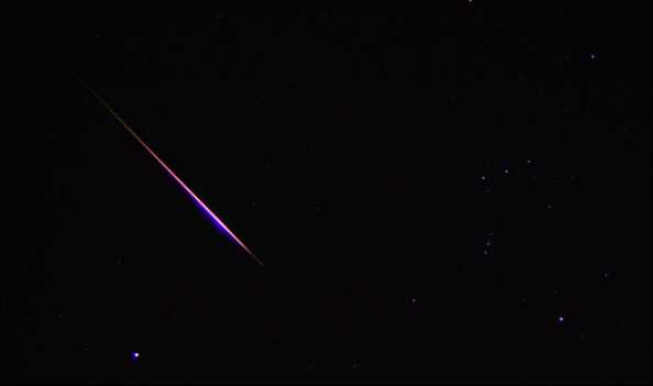 a single Leonid meteor streaks by in the night