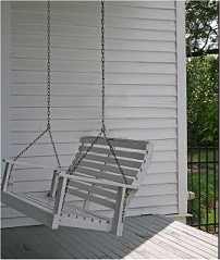 white painted porch swing