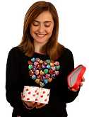 teen girl opening valentines day gift