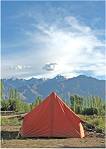 camp tent under a blue sky