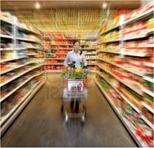 woman walking down the supermarket aisle