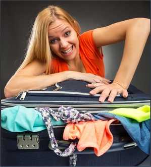 young woman packing for vacation