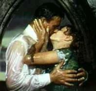 John Wayne and Maureen O'Hara share a kiss in The Quiet Man (1952)