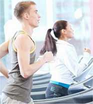 man and woman running on club treadmill